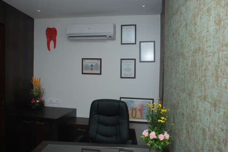 The consulting room showing framed dental qualifications